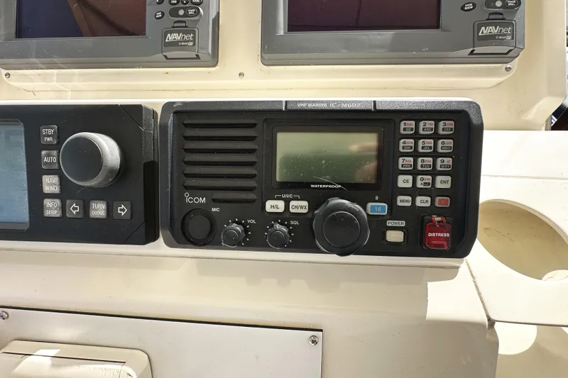 Slide: The Image of Control panel of a 2004 McKinna 57 PHMY Widebody yacht with navigation equipment. - 98