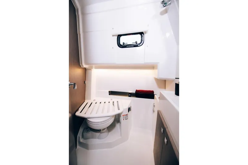 Slide: The Image of 2026 Jeanneau NC895 Sport boat bathroom with modern fixtures and compact design. - 17