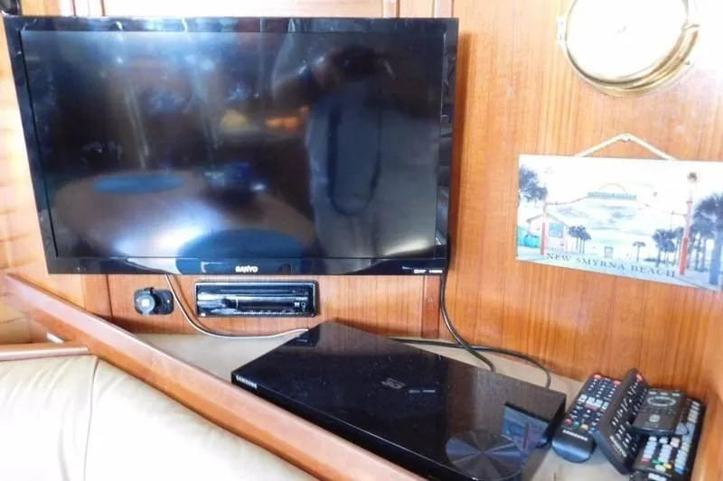 Slide: The Image of Entertainment setup on 1994 Hunter Passage 42 yacht with TV and electronics. - 11