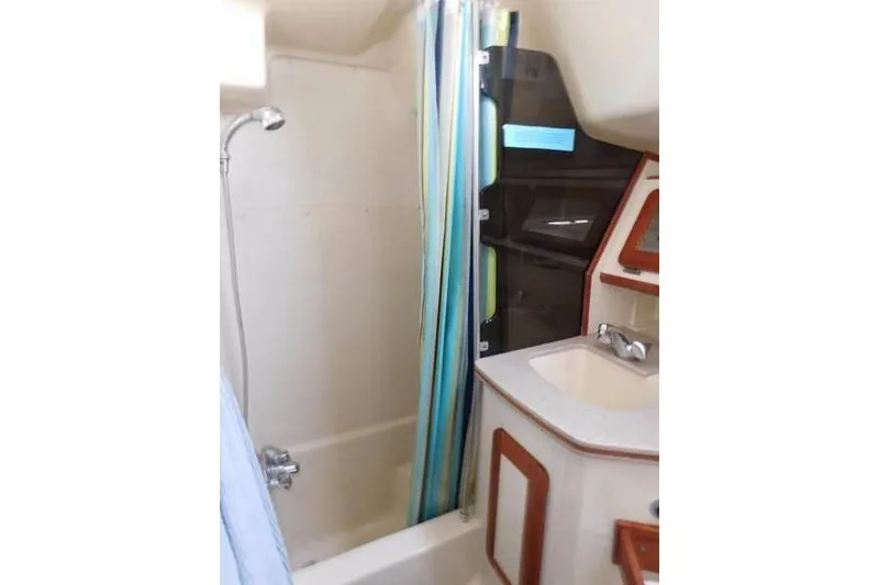 Slide: The Image of 1994 Hunter Passage 42 yacht bathroom with shower and sink. - 24