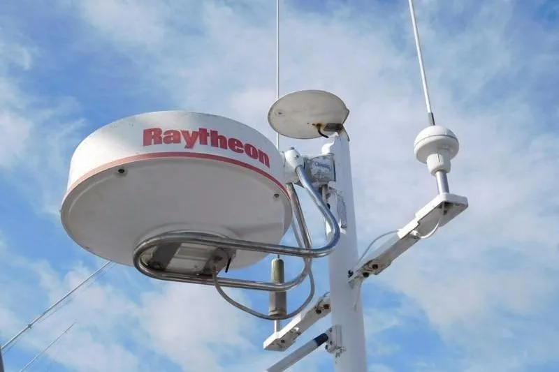 Slide: The Image of Radar equipment on a 1994 Hunter Passage 42 sailboat against a blue sky. - 6