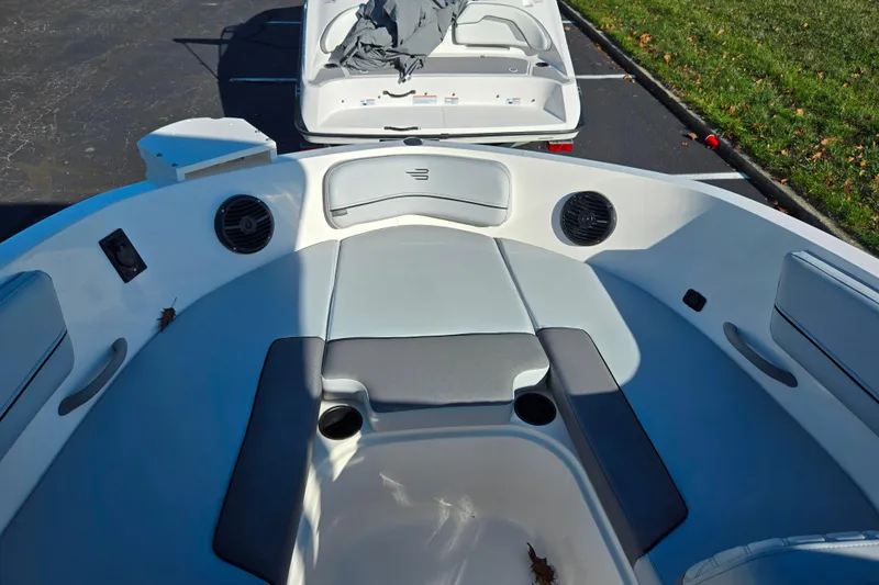 Slide: The Image of 2024 Bayliner VR5 Bowrider OB interior with seating and cup holders. - 16