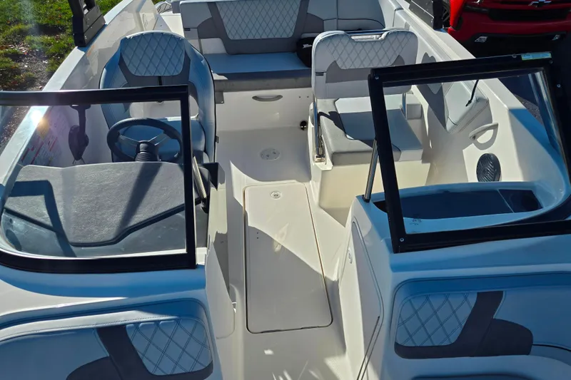 Slide: The Image of 2024 Bayliner VR5 Bowrider OB interior with modern seating and steering wheel. - 18