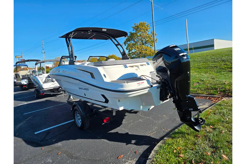 Slide: The Image of 2024 Bayliner VR5 Bowrider OB boat with outboard motor in parking lot. - 3