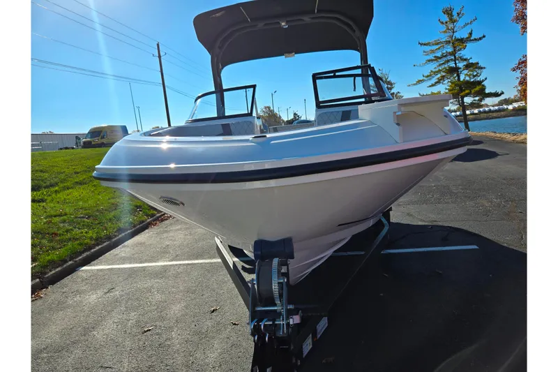 Slide: The Image of 2024 Bayliner VR5 Bowrider OB boat on trailer in parking lot. - 6