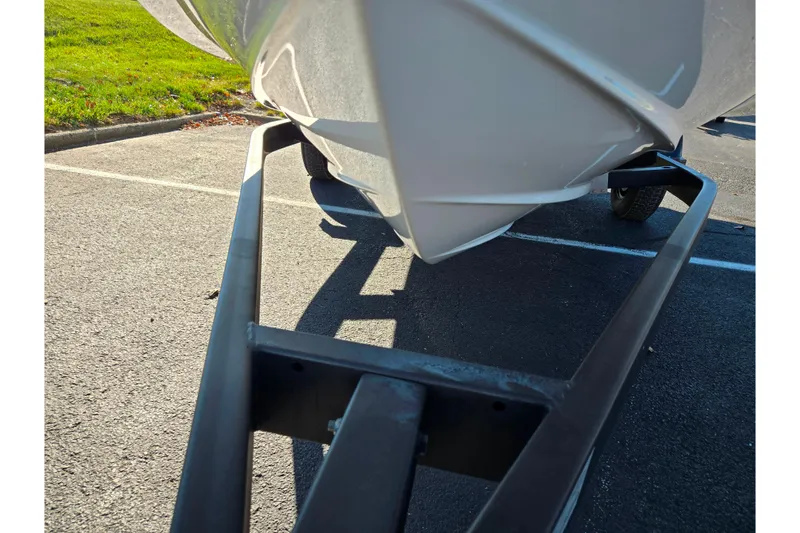 Slide: The Image of 2024 Bayliner VR5 Bowrider OB on trailer, parked on asphalt. - 7