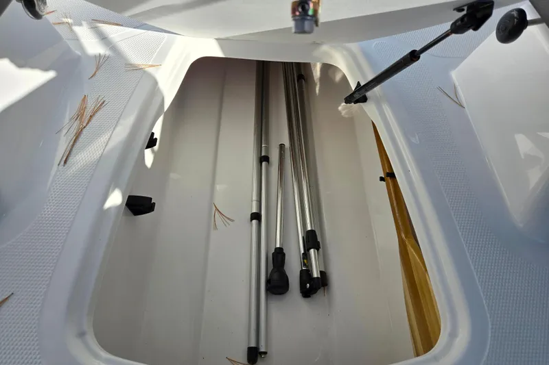 Slide: The Image of Storage compartment of 2023 Tahoe 185 S boat with metal poles inside. - 15