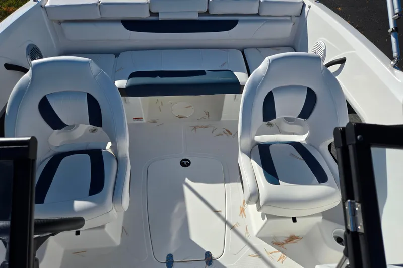Slide: The Image of 2023 Tahoe 185 S boat interior with white and blue seating arrangement. - 20