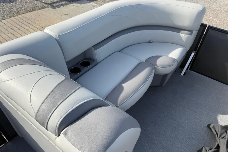 Slide: The Image of 2020 SunChaser Geneva Sport 22 LR DH boat interior with plush seating and cup holders. - 9