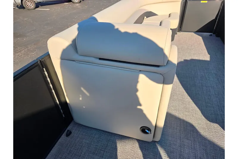 Slide: The Image of 2021 Barletta C24UC boat interior with beige seating and carpet flooring. - 21