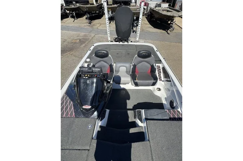 Slide: The Image of 2015 Skeeter ZX225 boat interior with dual seats and control panel. - 12