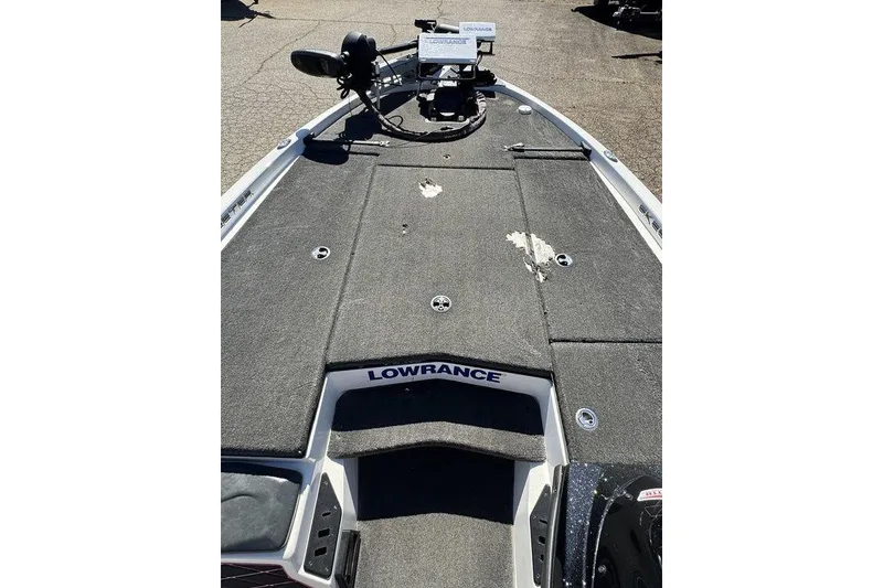Slide: The Image of 2015 Skeeter ZX225 boat deck with Lowrance equipment, showing wear and tear. - 13