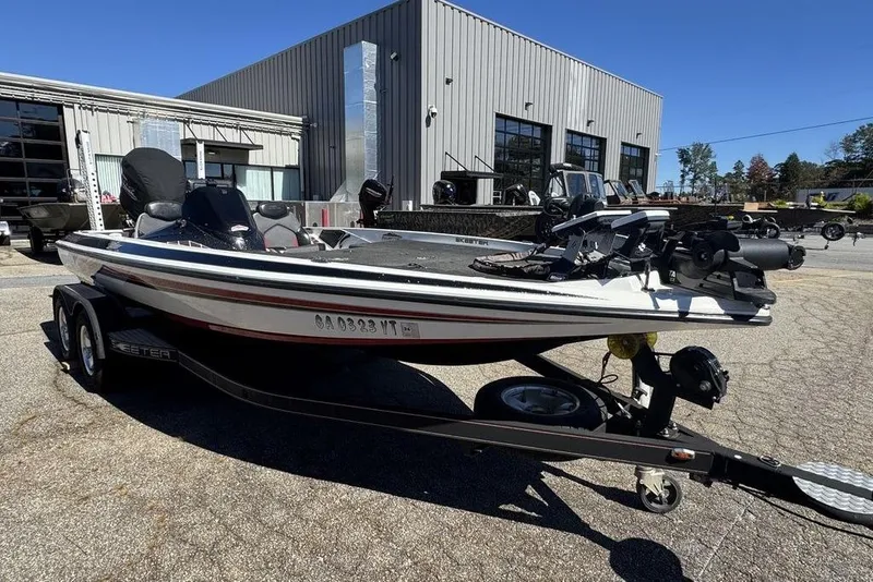 Slide: The Image of 2015 Skeeter ZX225 boat on trailer outside industrial building. - 4