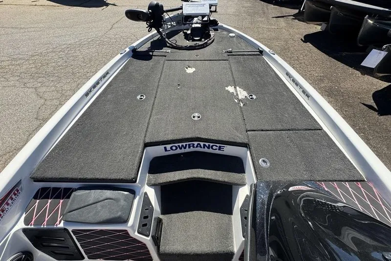 Slide: The Image of 2015 Skeeter ZX225 boat deck with Lowrance equipment, showing wear and tear. - 8