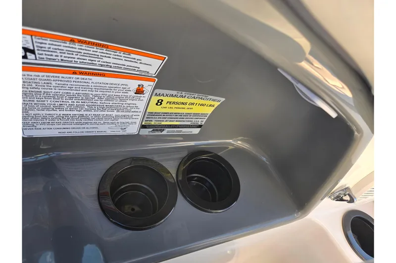 Slide: The Image of 2018 Yamaha SX190 boat warning labels and cup holders, capacity for 8 persons or 1,160 lbs. - 13