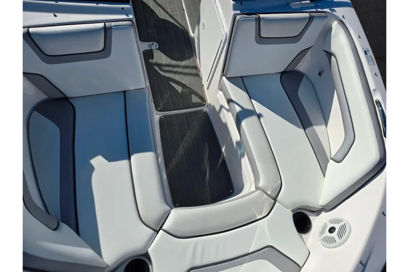 Slide: The Image of 2018 Yamaha Boats SX190 interior seating with gray upholstery and sleek design. - 18