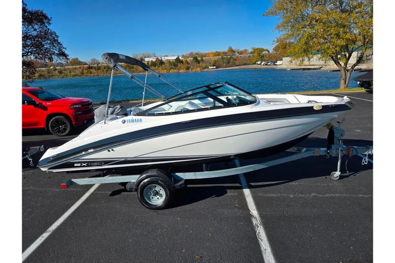 Slide: The Image of 2018 Yamaha Boats SX190 on trailer by a lake, ready for adventure. - 9