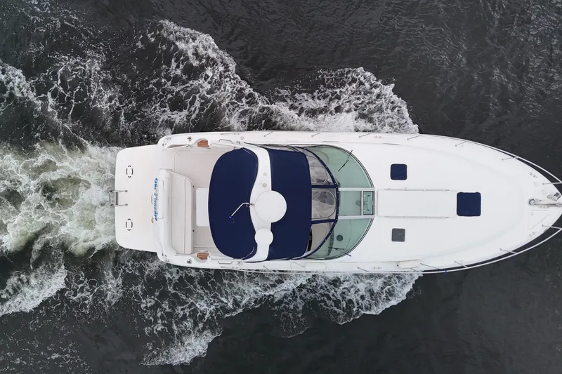 Slide: The Image of Aerial view of 1999 Sea Ray 340 yacht cruising through water. - 2