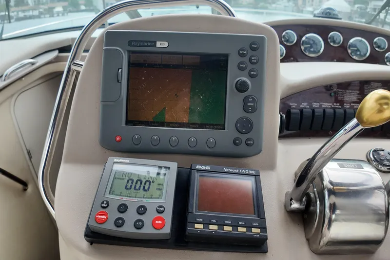 Slide: The Image of Control panel of a 1999 Sea Ray 340 boat with navigation instruments. - 33