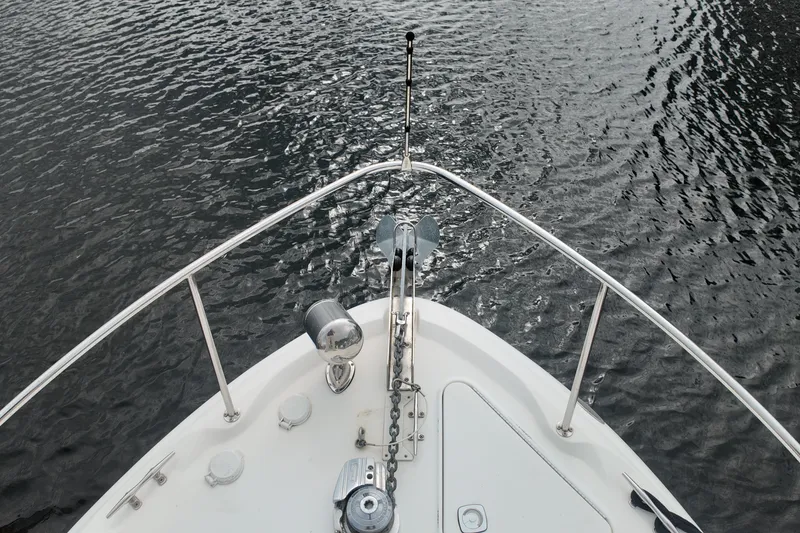 Slide: The Image of Bow view of 1999 Sea Ray 340 boat on water. - 9