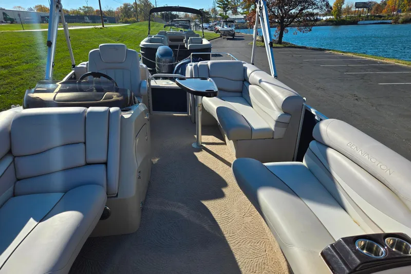 Slide: The Image of 2011 Bennington 2275RCW OB pontoon boat with spacious seating and elegant interior design. - 11