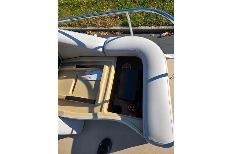Slide: The Image of Open storage compartment on a 2011 Bennington 2275RCW OB boat, showing interior details. - 17