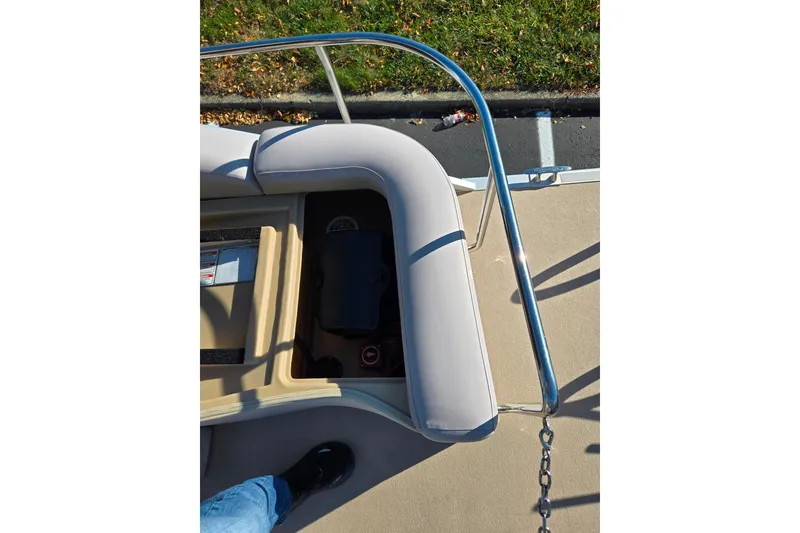 Slide: The Image of 2011 Bennington 2275RCW OB boat interior with cushioned seating and railing. - 18
