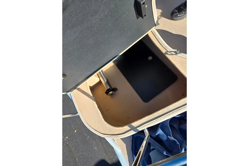 Slide: The Image of Open storage compartment on 2011 Bennington 2275RCW OB boat, showing interior details. - 19