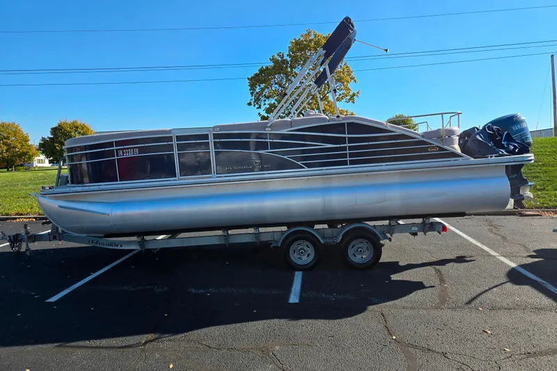 Slide: The Image of 2011 Bennington 2275RCW OB pontoon boat on trailer in parking lot. - 4