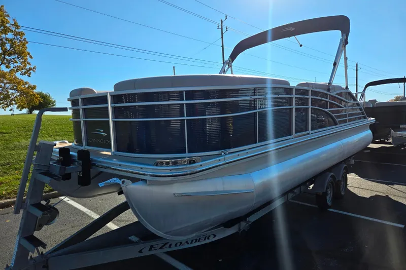 Slide: The Image of 2011 Bennington 2275RCW OB pontoon boat on trailer in parking lot. - 5