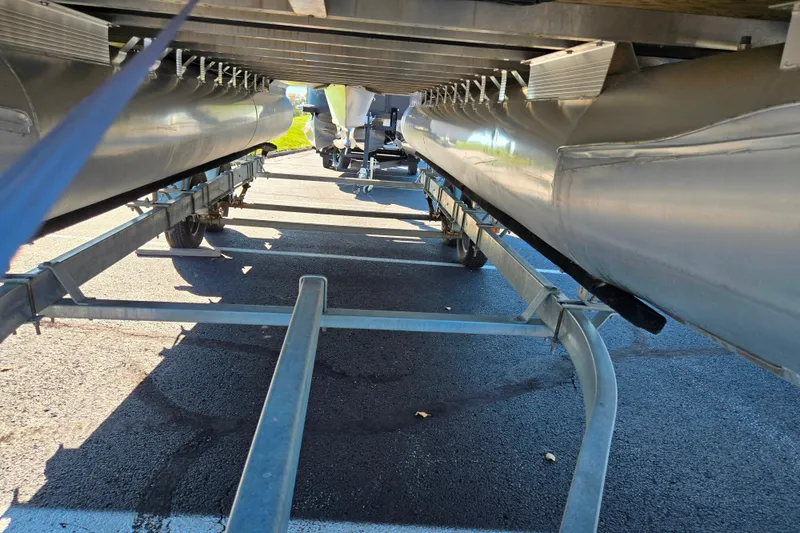 Slide: The Image of Underneath view of a 2011 Bennington 2275RCW OB pontoon boat on a trailer. - 7