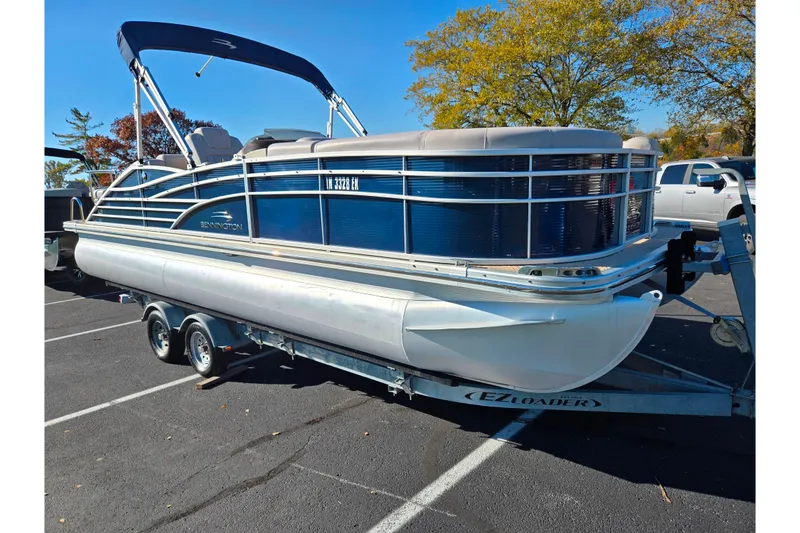 Slide: The Image of 2011 Bennington 2275RCW OB pontoon boat on trailer in parking lot. - 8