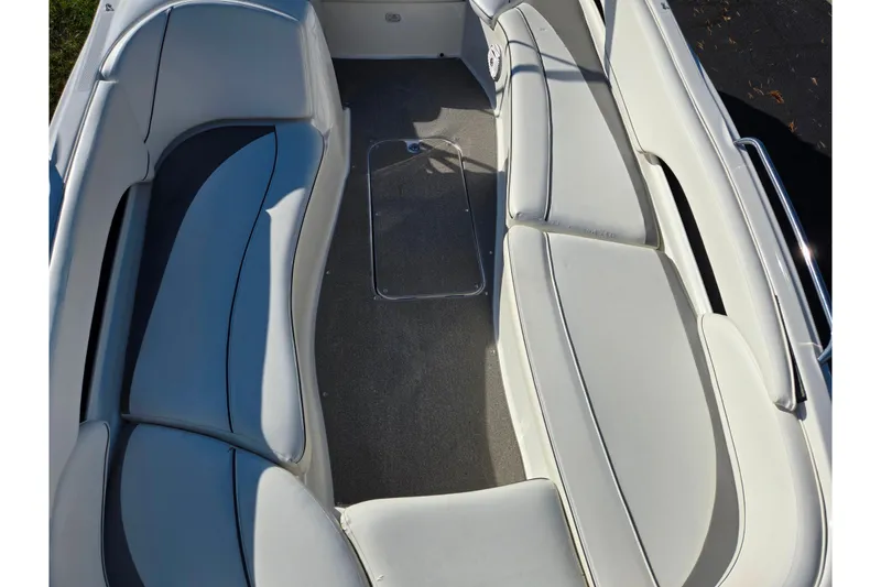 Slide: The Image of 2011 Bayliner 197 boat interior with spacious seating and sleek design. - 16