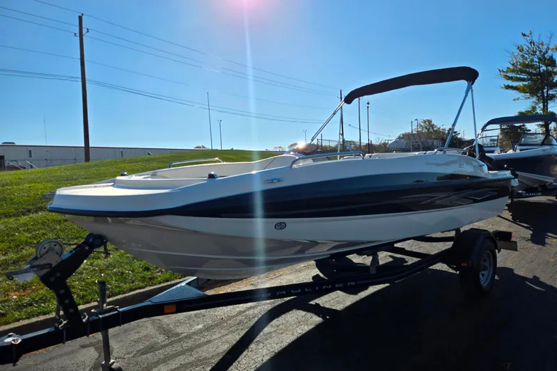 Slide: The Image of 2011 Bayliner 197 boat on trailer under sunny sky. - 5