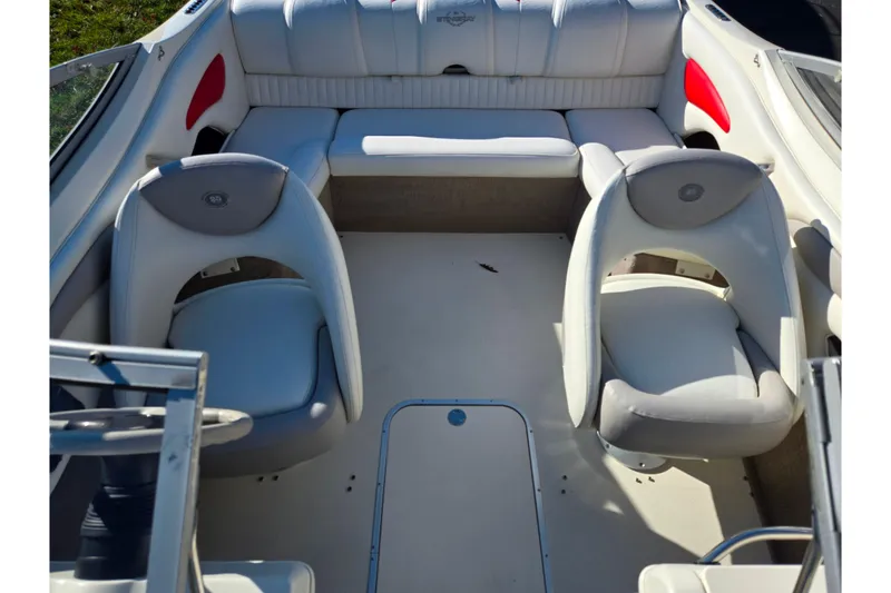 Slide: The Image of 2005 Stingray 195 LR boat interior with white seating and red accents. - 20