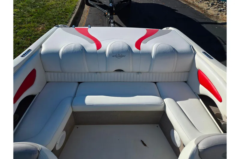 Slide: The Image of 2005 Stingray 195 LR boat interior with white and red seating. - 21