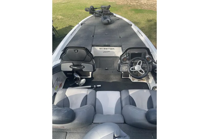 Slide: The Image of 2013 Skeeter FX21 boat interior with steering wheel and seating. - 5