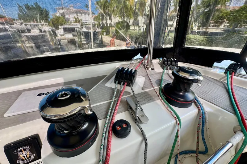 Slide: The Image of Cockpit of 2020 Lagoon 42 catamaran with winches and colorful ropes. - 14