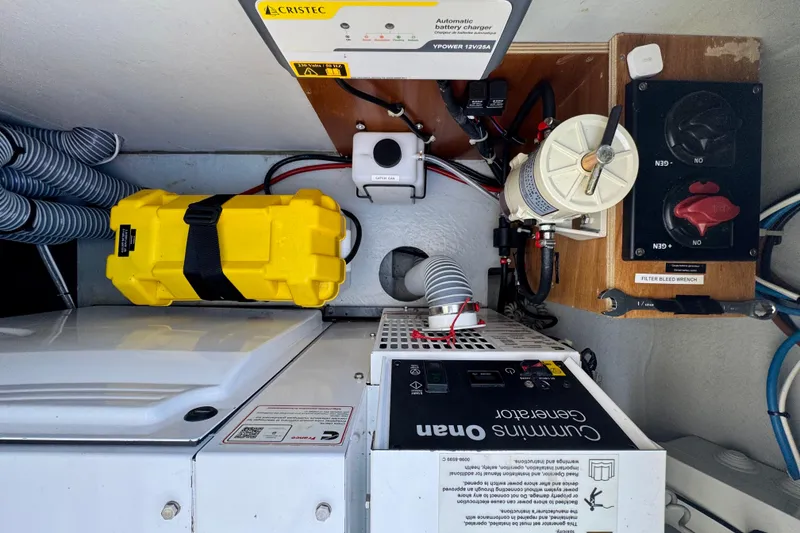 Slide: The Image of Engine room of 2020 Lagoon 42 catamaran with Cummins Onan generator and battery charger. - 16