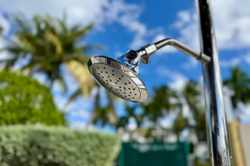 Slide: The Image of Outdoor showerhead on Lagoon 42 yacht, 2020 model, with tropical background. - 21