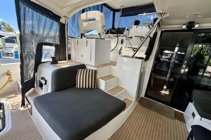 Slide: The Image of Interior of 2020 Lagoon 42 catamaran with seating, helm, and modern design. - 4