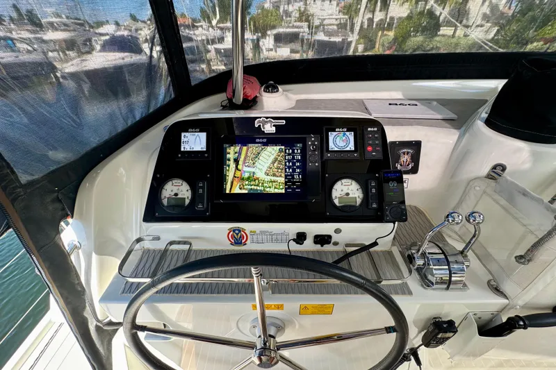 Slide: The Image of Cockpit of 2020 Lagoon 42 catamaran with navigation instruments and steering wheel. - 6