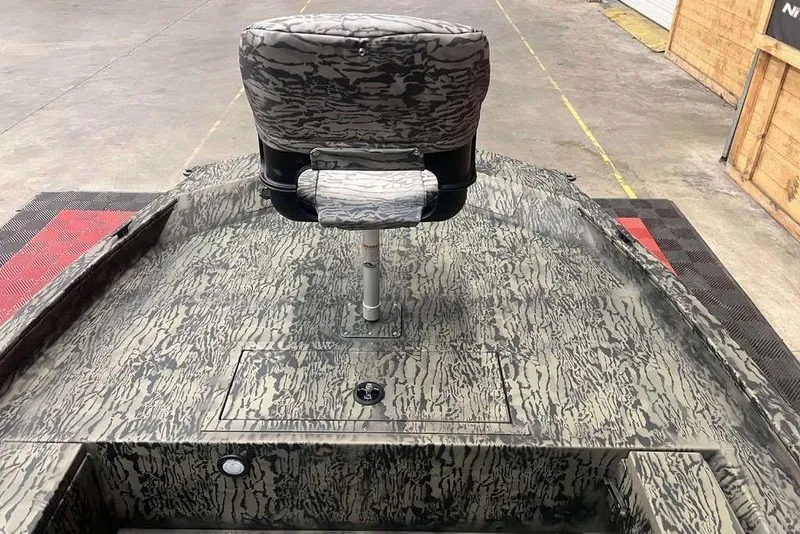 Slide: The Image of 2026 Tracker Grizzly 1654 Sportsman boat with camouflage pattern on display. - 5