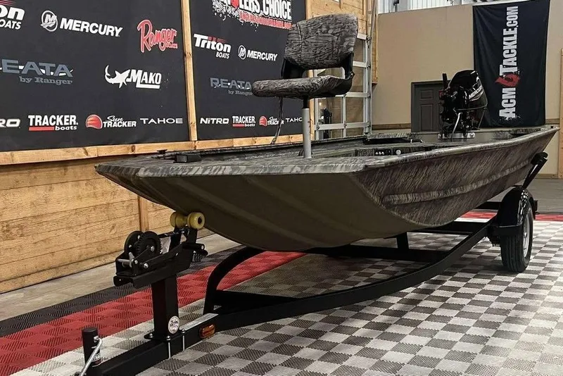 Slide: The Image of 2026 Tracker Grizzly 1654 Sportsman boat interior with camouflage pattern. - 7