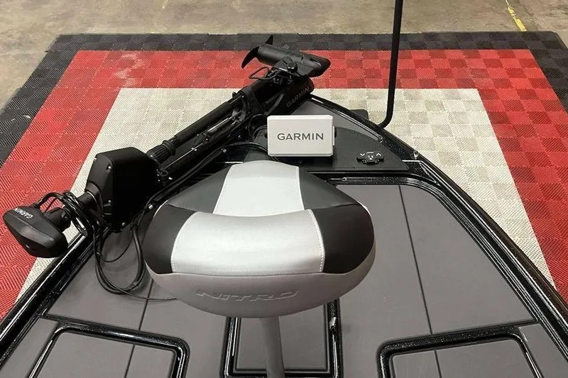 Slide: The Image of 2026 Nitro Z20 XL Pro boat with Garmin equipment on red and white checkered floor. - 8