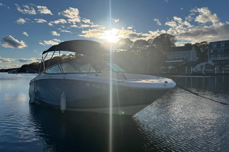 Slide: The Image of 2017 Regal 23 OBX boat on calm water at sunset. - 20