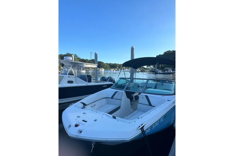 Slide: The Image of 2017 Regal 23 OBX boat docked at marina under clear blue sky. - 21