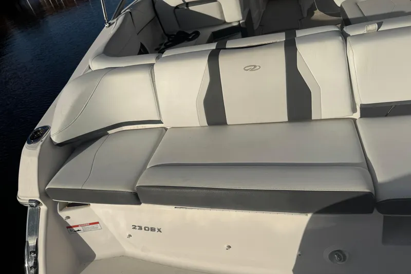Slide: The Image of 2017 Regal 23 OBX boat interior with white and gray seating. - 7