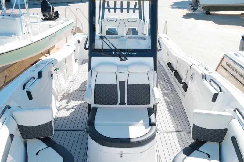 Slide: The Image of 2021 Tidewater 292 CC Adventure boat interior with modern seating and sleek design. - 11