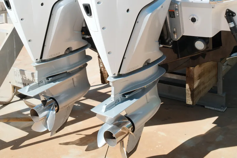 Slide: The Image of Twin outboard motors on a 2021 Tidewater 292 CC Adventure boat. - 2